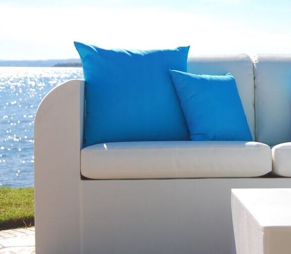 Blue cushions on a white outdoor sofa in Malaga, Costa del sol
